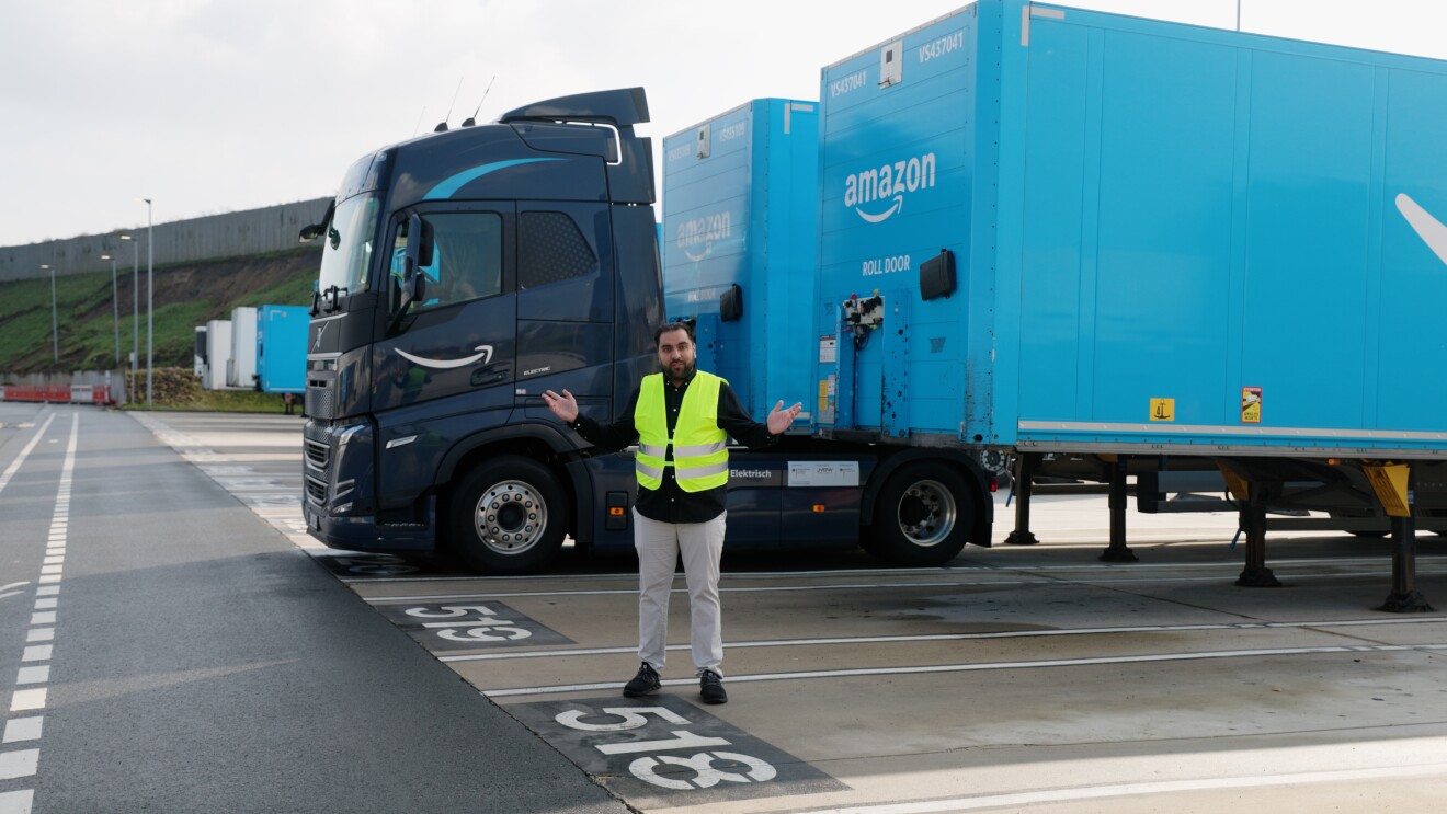 Samir Peros stands in front of Amazon's electric truck