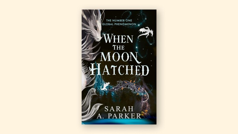 Book cover: 'When the Moon Hatched' by Sarah A. Parker, featuring ethereal dragon imagery