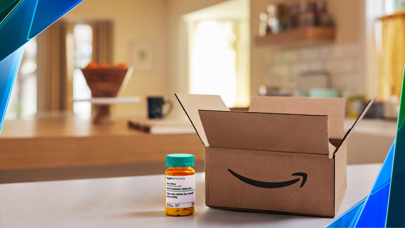 A photo of an Amazon package next to a prescription bottle on a tabletop.