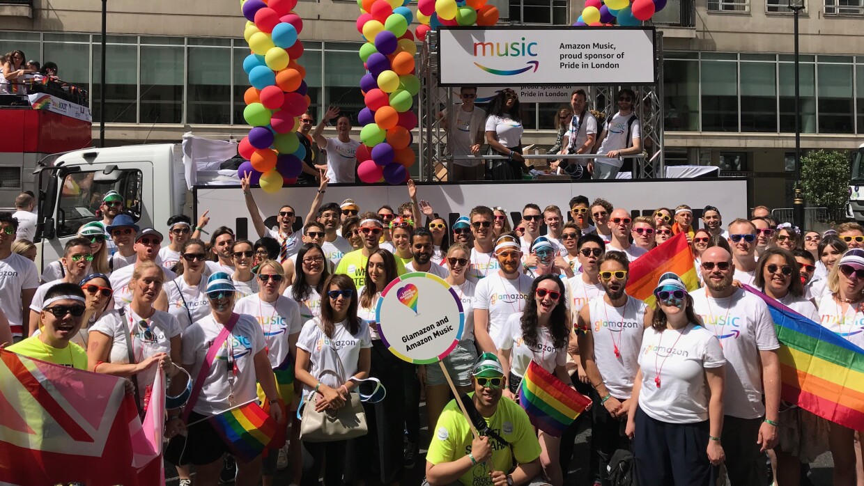 Group shot of Pride in London with float in the background