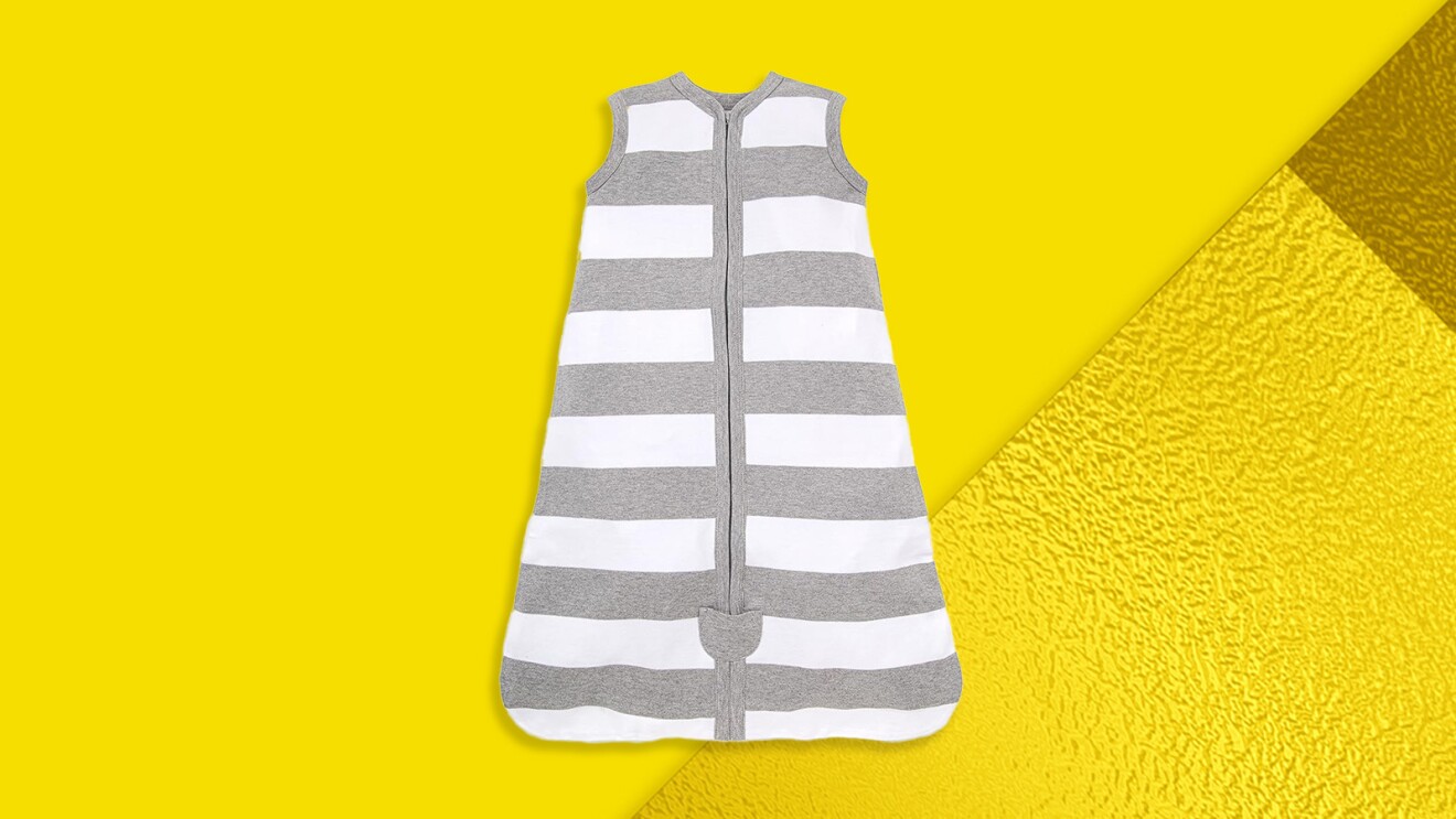 Gray and white striped sleep sack for infants on yellow background