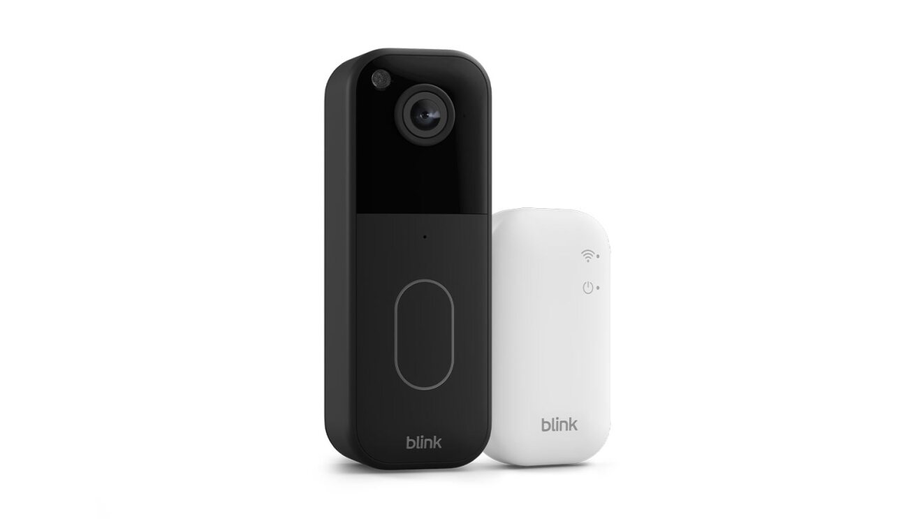 Black Blink doorbell camera next to white sync module