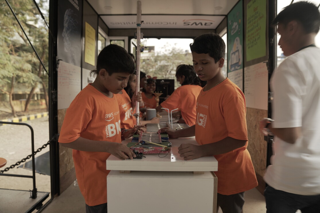 Kids work on a Science project in the STEAM bus