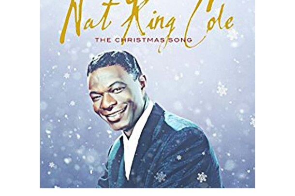 Nat King Cole wears a suit, facing the camera with a smile. The background is a blue-gray and appears to fade from light to darker gray-purple. Snow falls around him, with snowflakes in front of him. Nat King Cole is scrawled across the top in gold, with "The Christmas Song" in red, below.