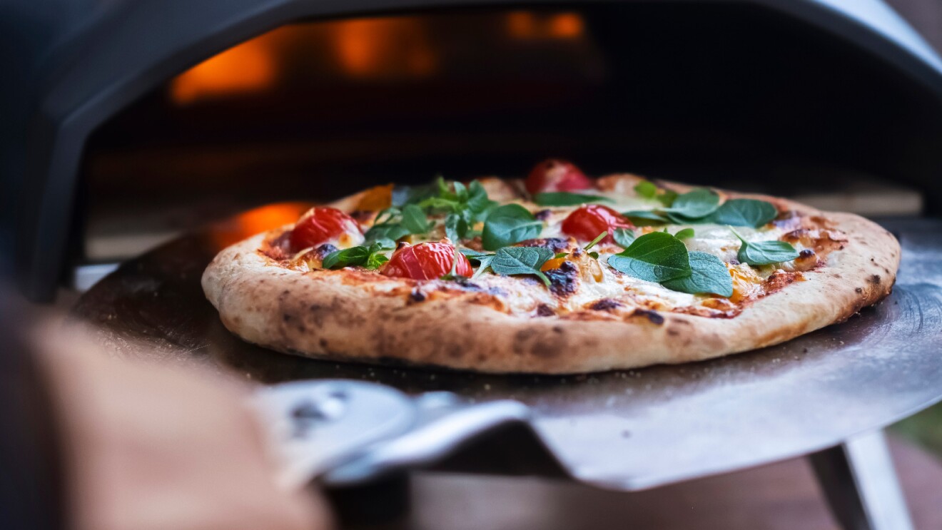 Prime Day 2023 live blog best deals: a pizza being pulled out of a stone fire oven.
