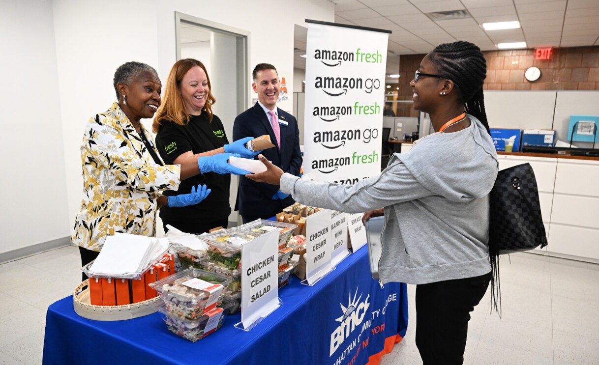 An image of people standing at a booth