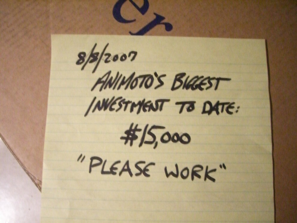 An image of a sticky note that has the date "8/8/2007" on it and says "Animoto's Biggest investment to date: $15,000 'please work'"