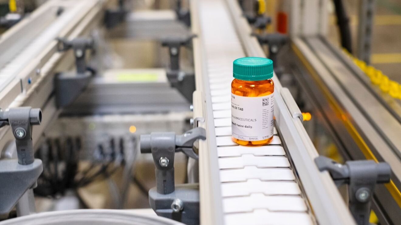 Amazon Pharmacy medication bottle on conveyor belt