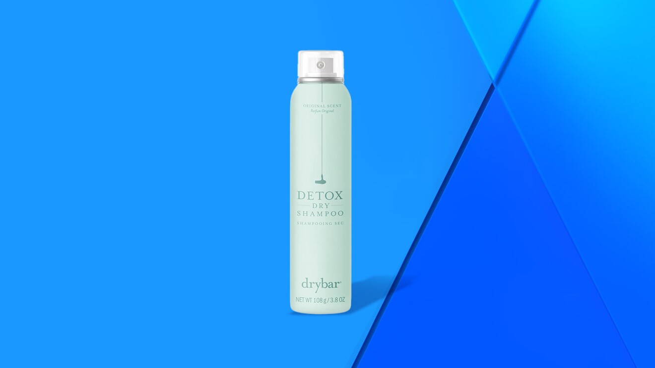 Detox dry shampoo bottle against blue background