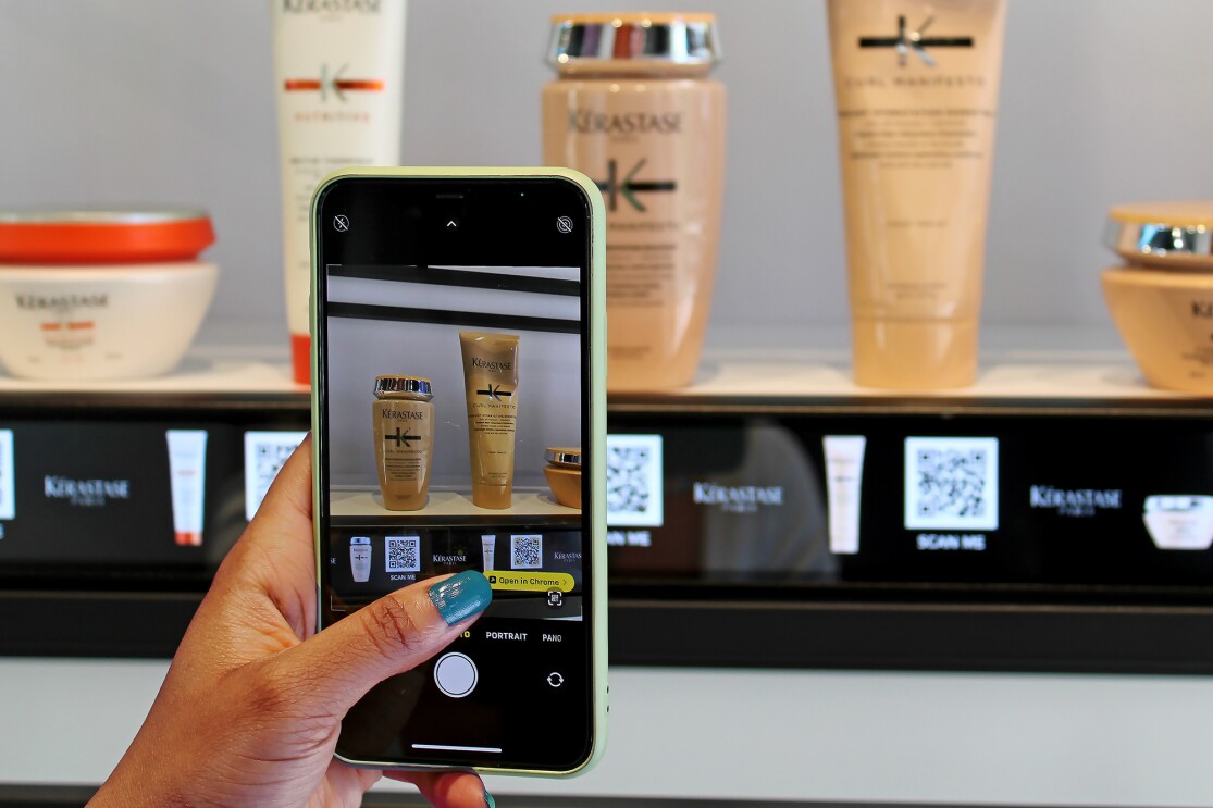 Using the QR codes on shelves inside amazon salon