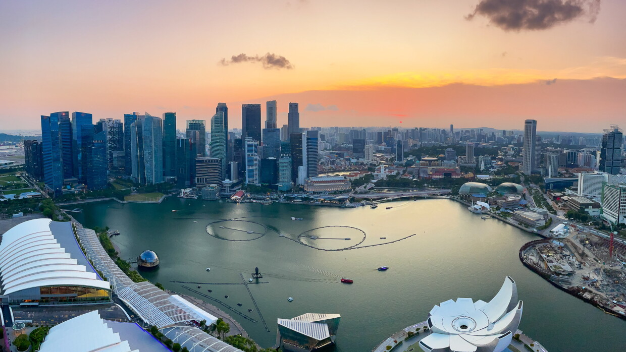 An image of Singapore's central business district at sunset