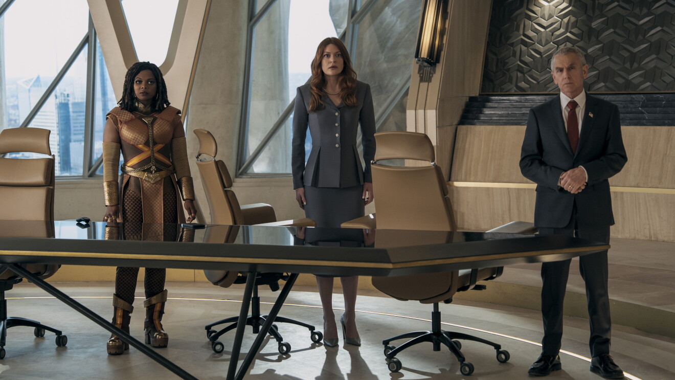  The Boys: Three diverse professionals in a modern office boardroom