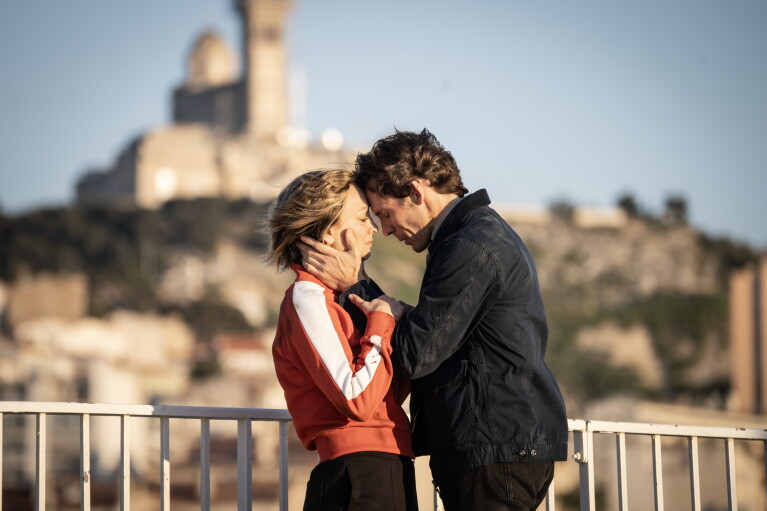 Two people having an intimate moment in the sunshine