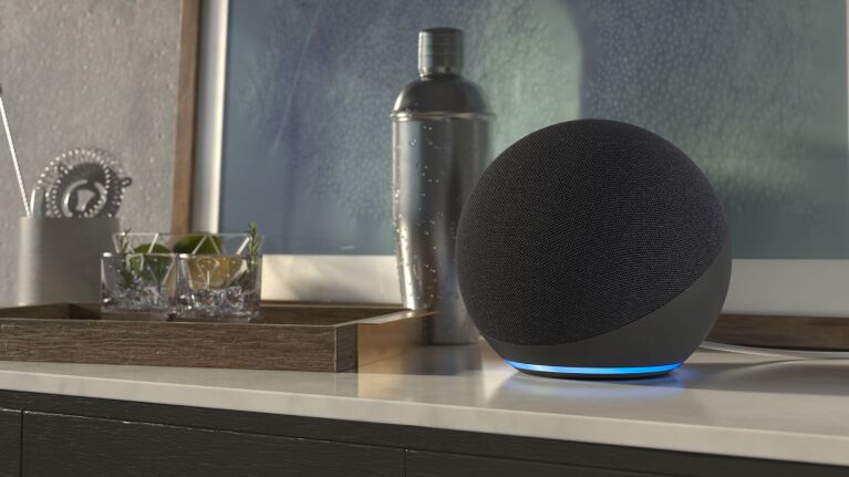 The Amazon Echo smart speaker sitting on a countertop.