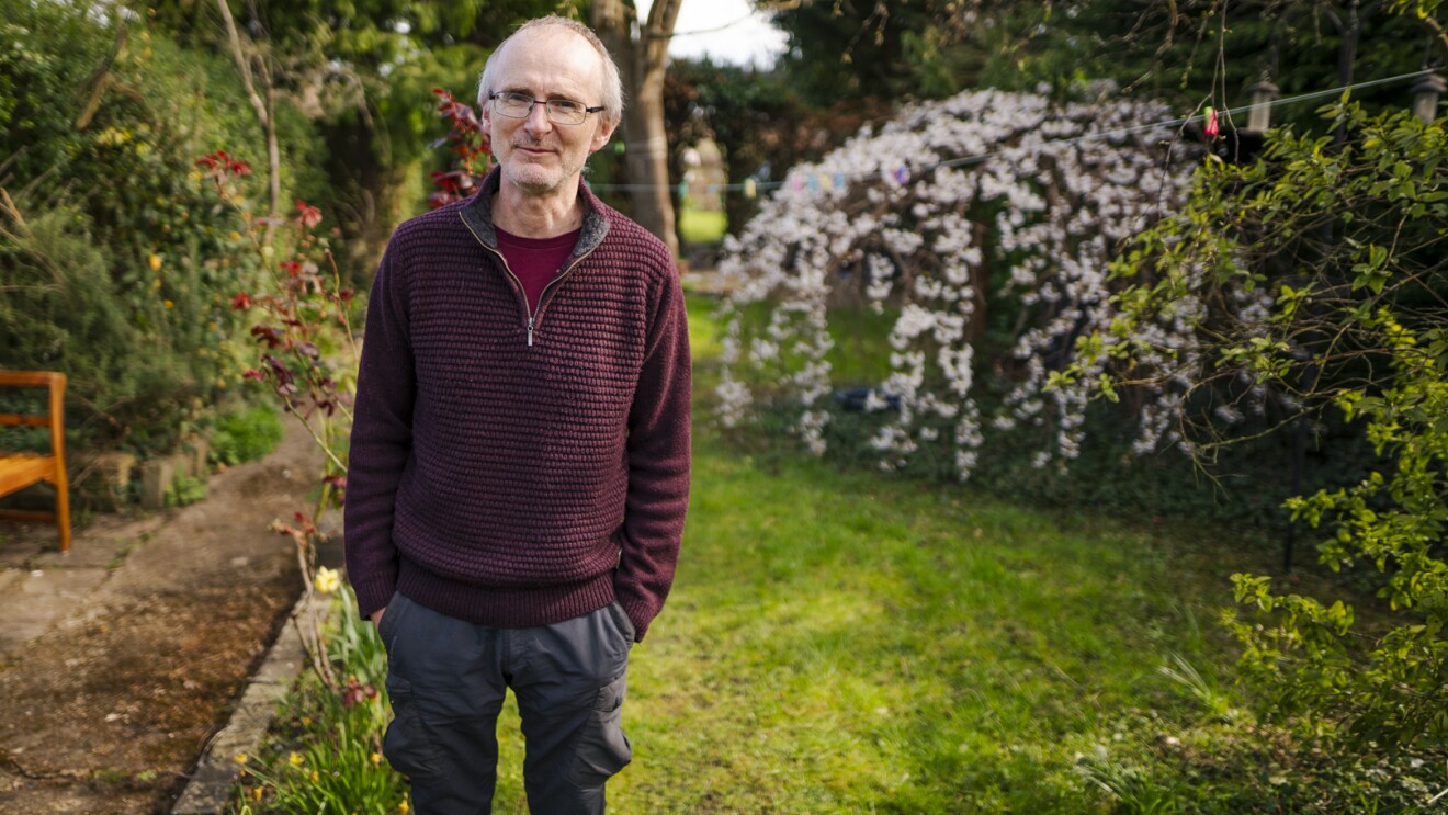 Portrait of Andrew Trehearne, who is taking part in UK Biobank's Long Covid research, in his garden