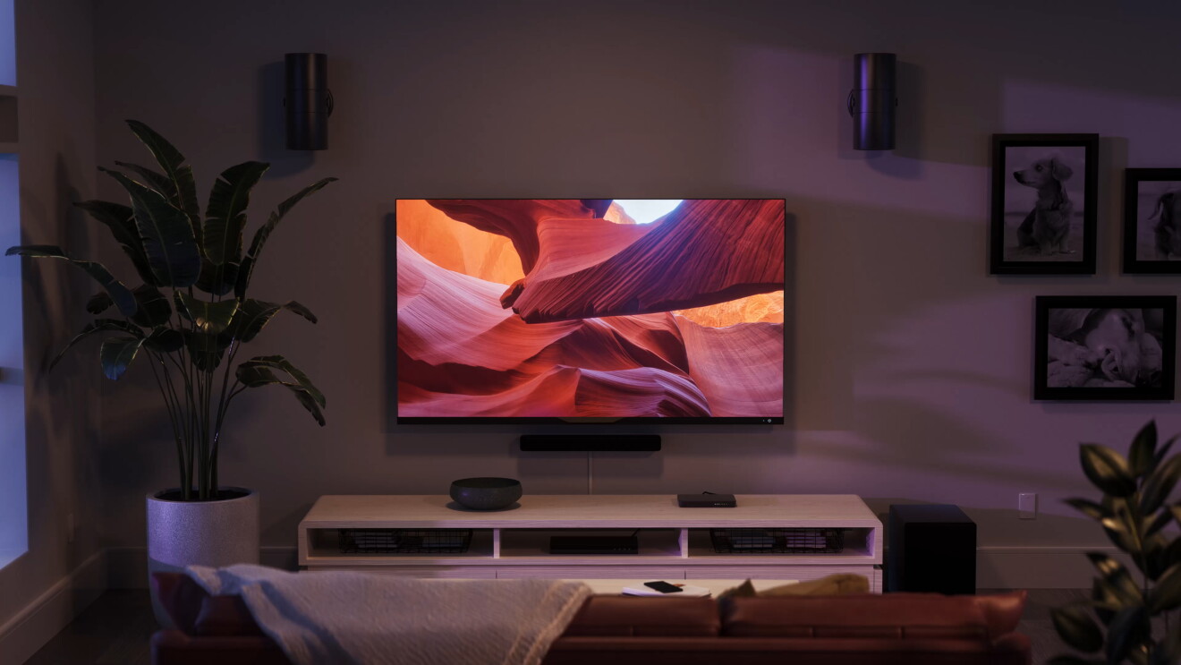 The Amazon Fire TV Stick 4K Max in a dark living room