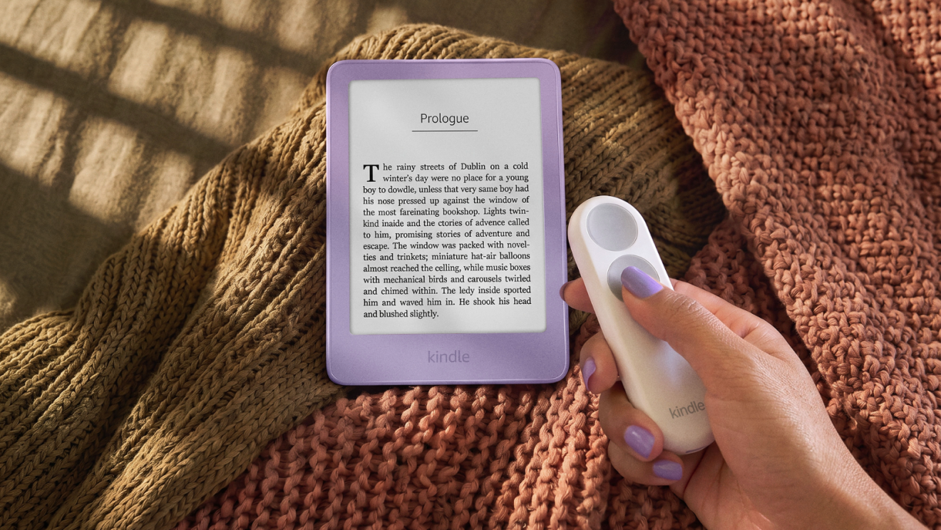 Official Amazon photo of the separate Kindle Click remote beside a Kindle; not the pogo-pin cover