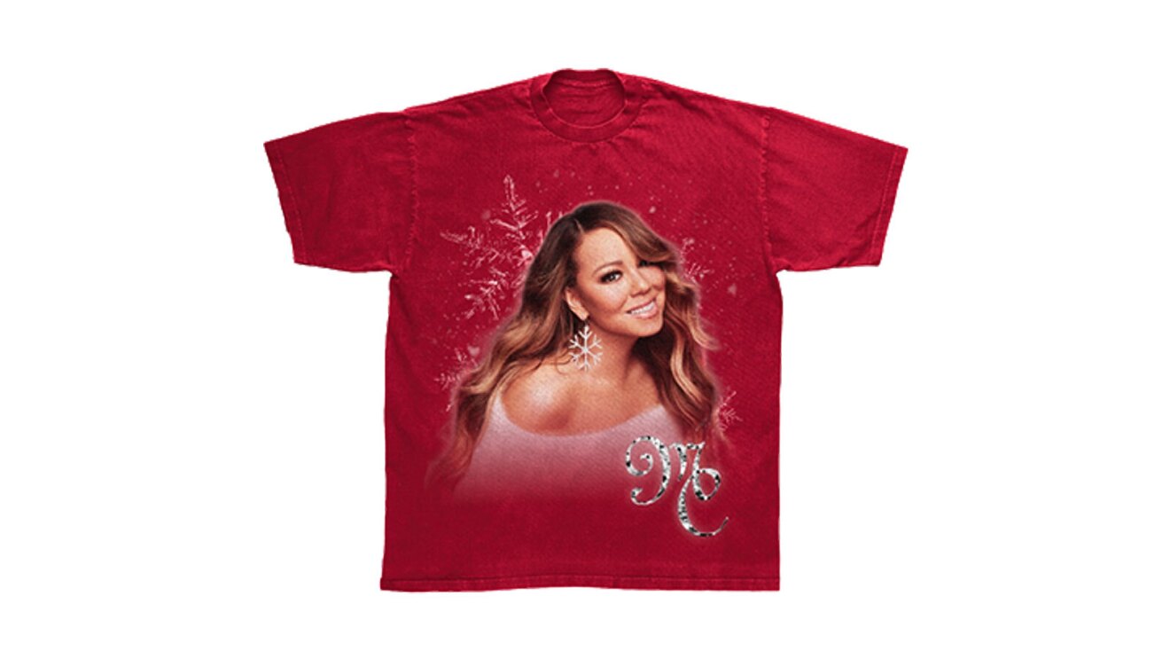 An image of a red tee shirt with Mariah Carey on the front. Below her image is lettering that says "MC"