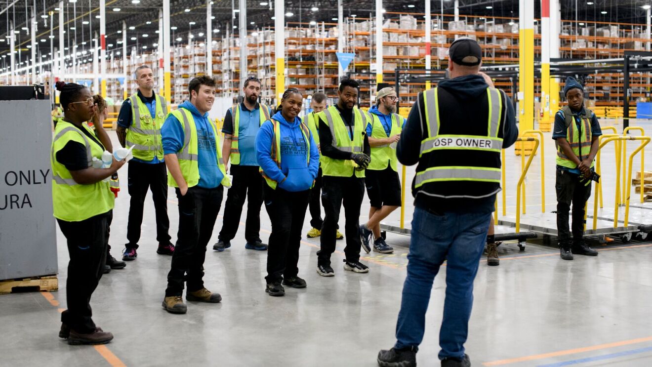 DSP owner addressing team in large distribution center