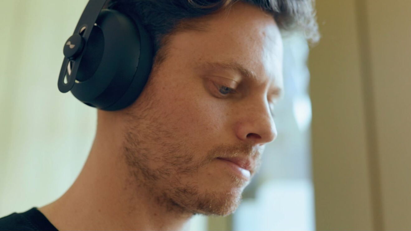 Person listening to NURA headphones