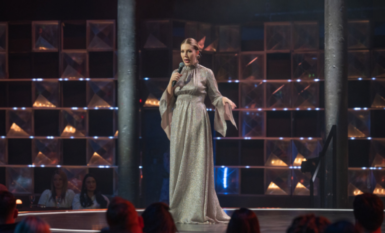 Katherine Ryan performing on stage for her Amazon Prime Video show Backstage with Katherine Ryan