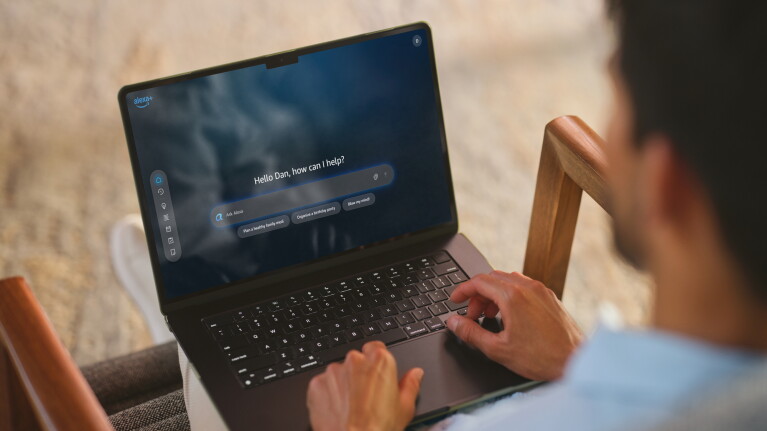 A man using his laptop to access alexa.com