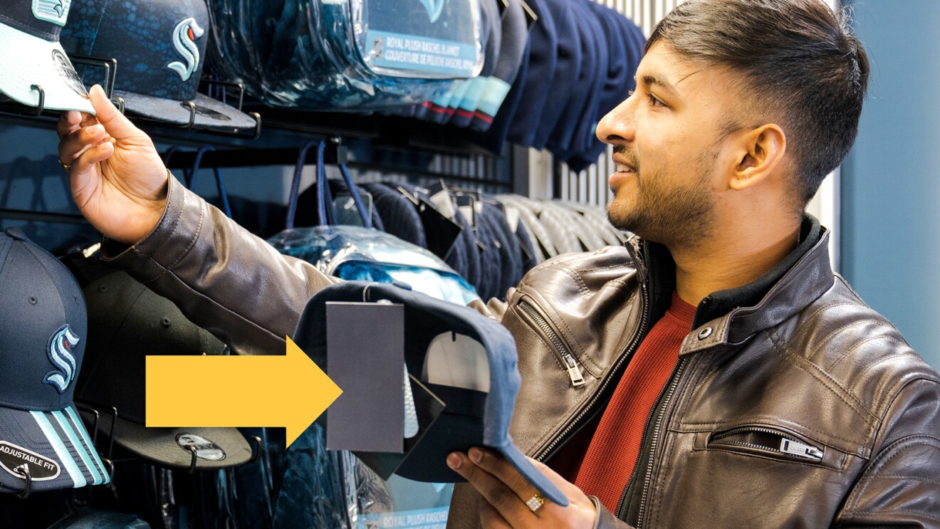 A photo of a customer shopping in a store at Climate Pledge Arena that uses Just Walk Out technology.