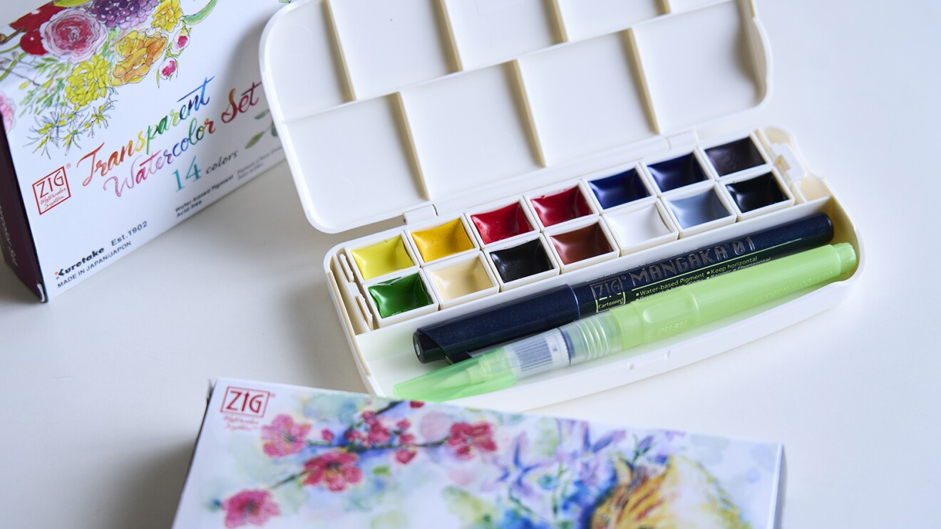 白いパレットと一体になった14色の固形絵具のセット。筆も入るスペースがある