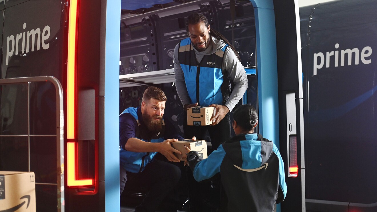 Football players Richard Sherman and Ryan Fitzpatrick driving Amazon’s electric delivery vans and delivering packages.