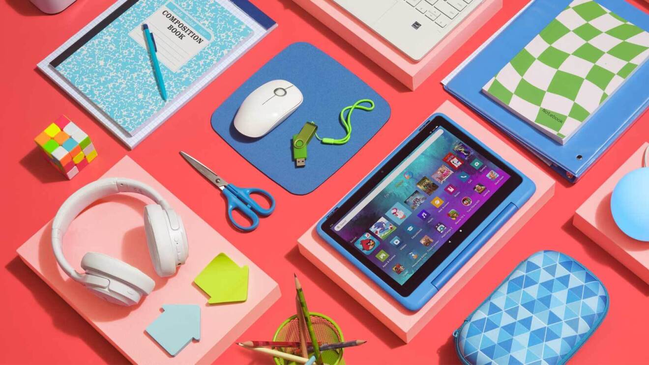 Prime Day 2023 live blog best deals: overhead image of school supplies on a bright pink background.