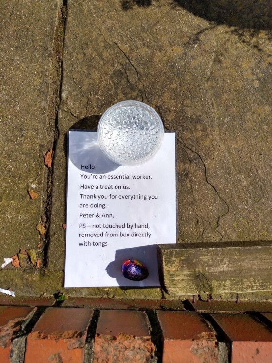 A note with a chocolate left behind for an Amazon delivery driver.