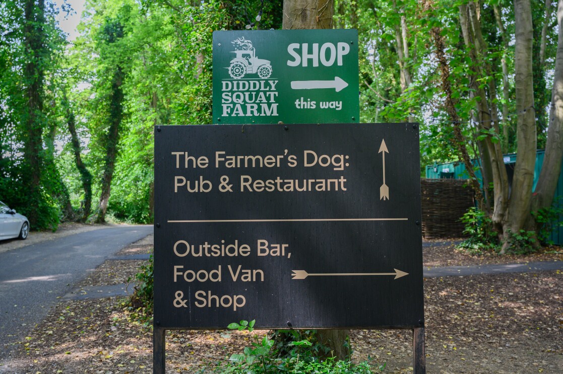 The sign directing you to The Farmer's Dog in Burford, Jeremy Clarkson's proper British pub from Clarkson's Farm season 4