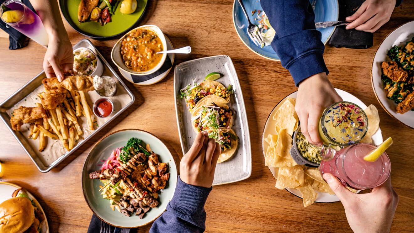 A photo of several plats food served by Makers Union on top of a table.