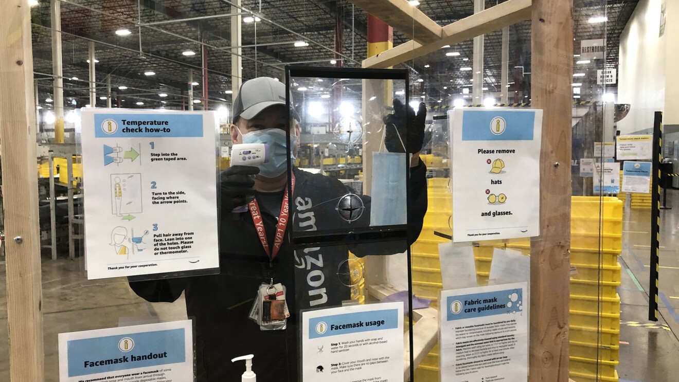 Anazon associate wearing a mask while working