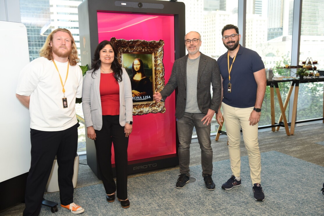 people standing in front of photo