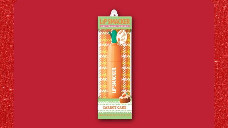 Lip Smacker Carrot Cake flavored lip balm packaging on red background