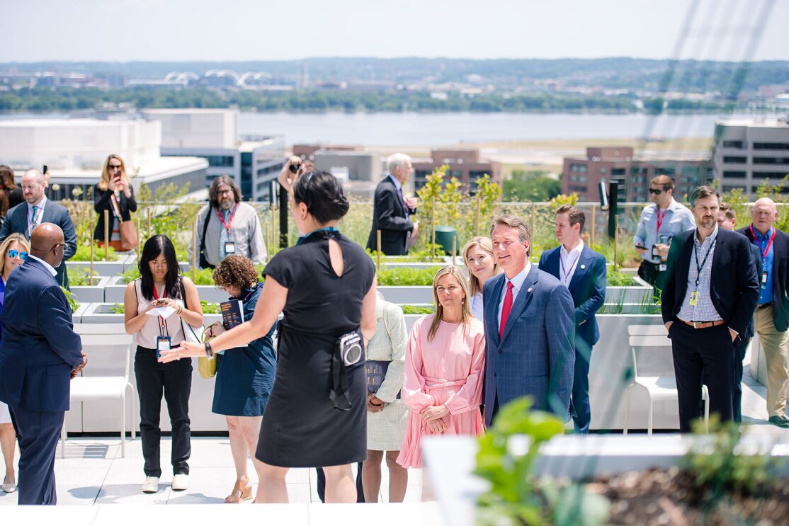 An image of local officials touring Amazon's second headquarters on its opening day