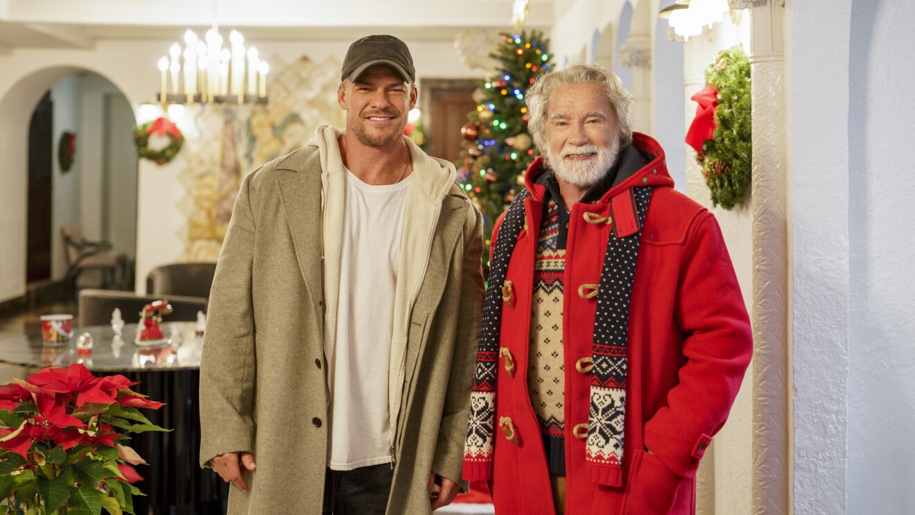 The Man with a Bag: Two men smiling in festive home with Christmas tree and decorations in background