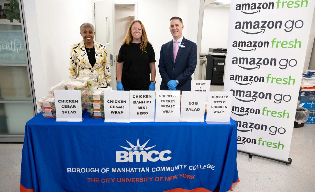 An image of people standing at a booth