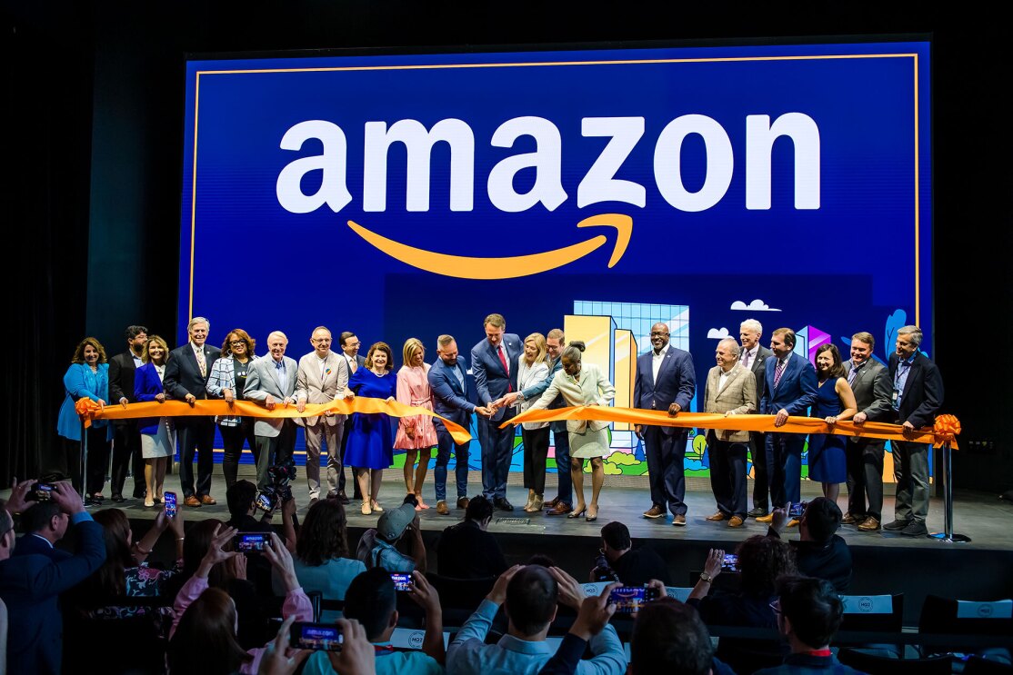 An image of local officials touring Amazon's second headquarters on its opening day