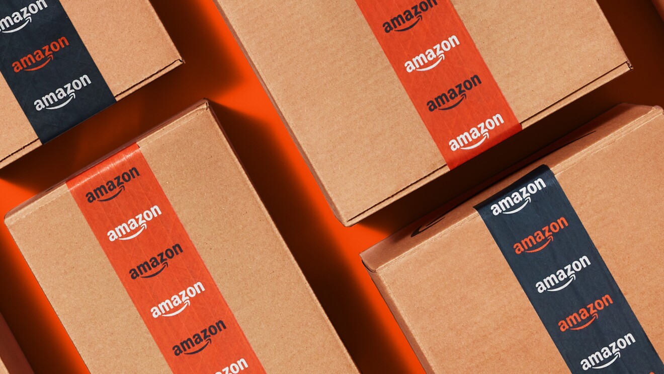 An image of Amazon boxes with the blue and orange tape assigned for the Cyber Monday and Black Friday deals season in 2022