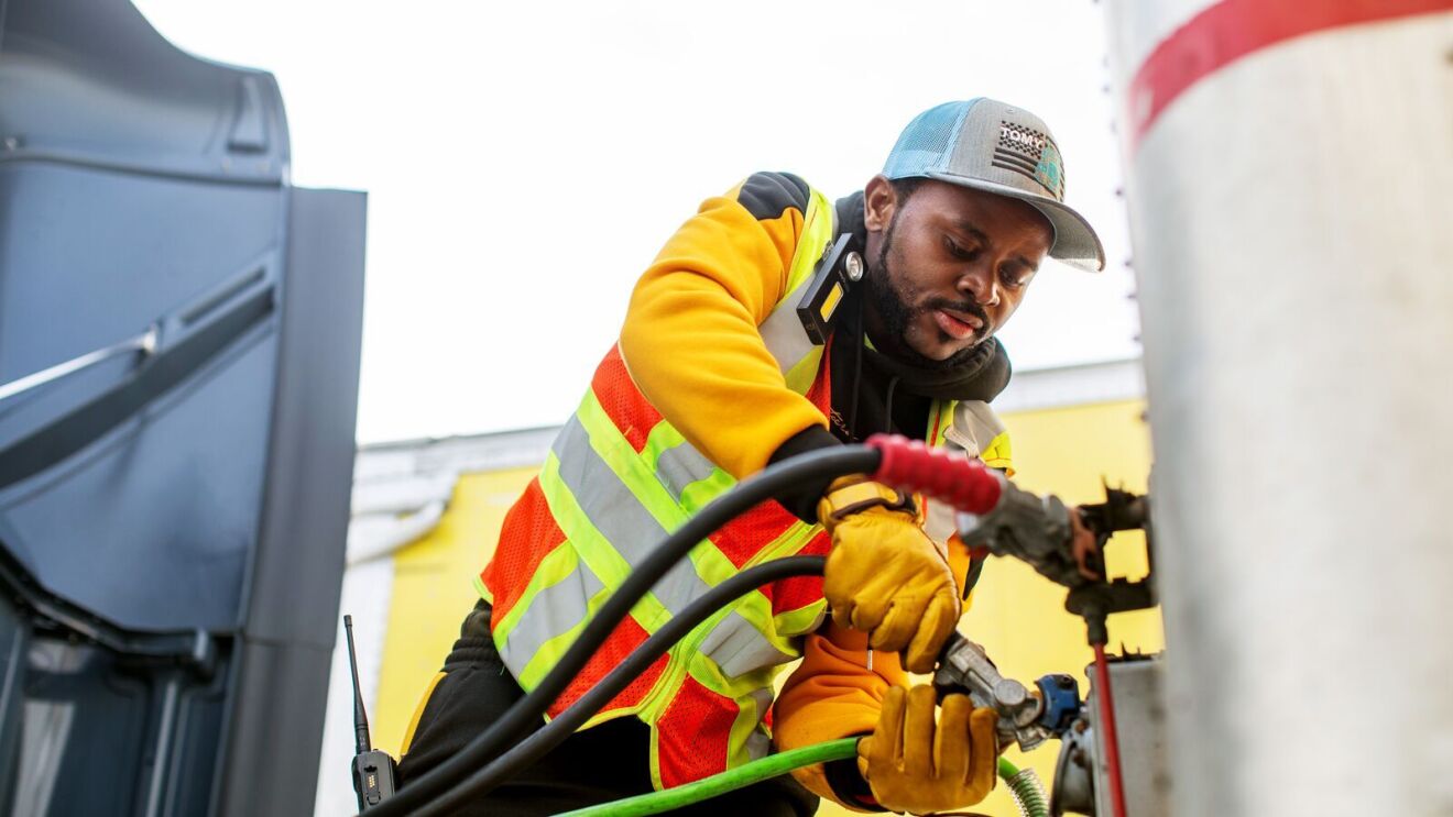 portraits and environmental photos of abel tuyisenge, a transportation operations management associate at amazon, as he drives and inspects trucks