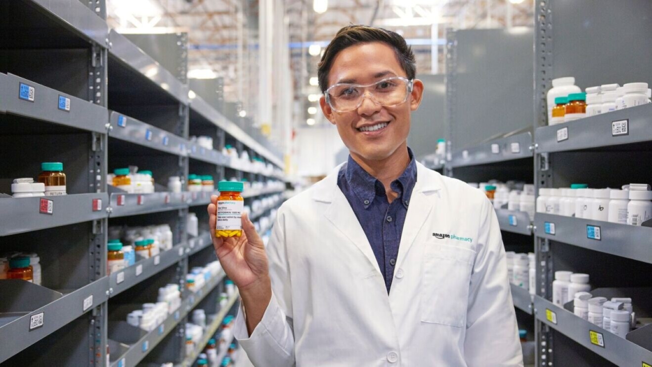 Pharmacist holding medication bottle in Amazon Pharmacy warehouse