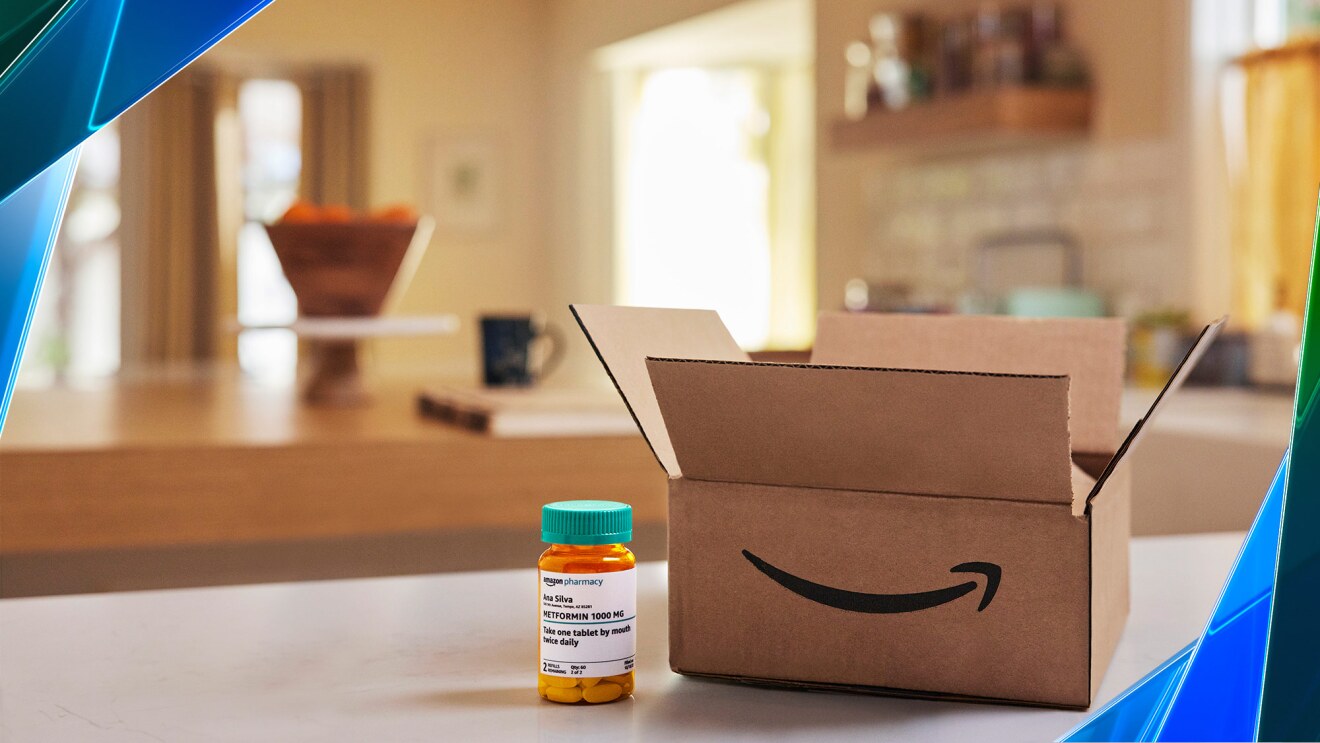 A photo of an Amazon package next to a prescription bottle on a tabletop.