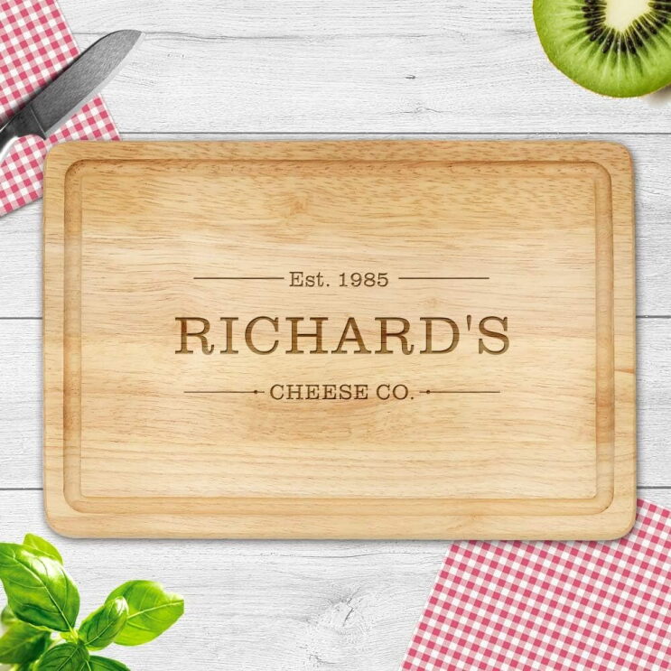 A chopping board that says "Richard's Cheese Co"