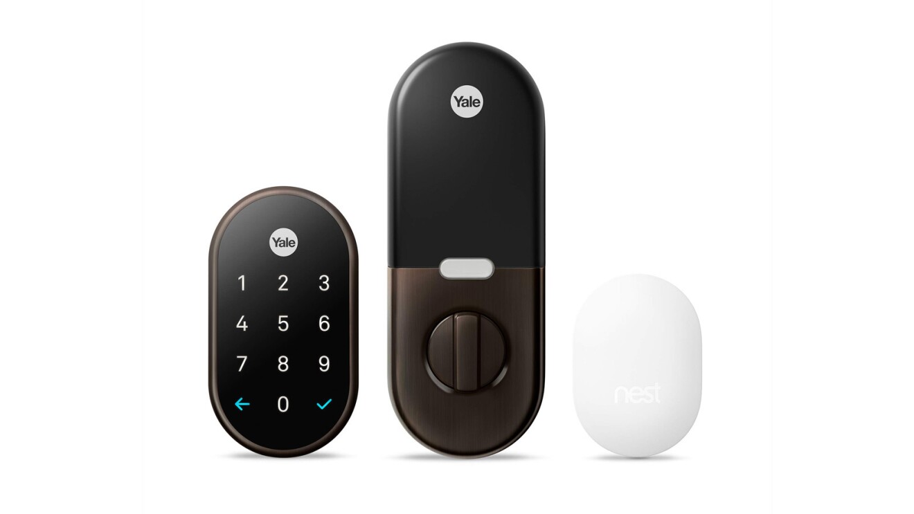 An image of the Yale keyless lock. There are three parts. One is a keypad, the other is the lock for the other side of the door, and the third piece is a white, round device.