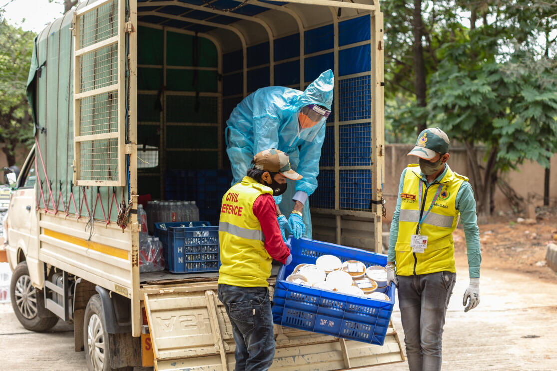 Workers unload essential rations for those in need as part of the Amazon and AkshayPatra meals program.