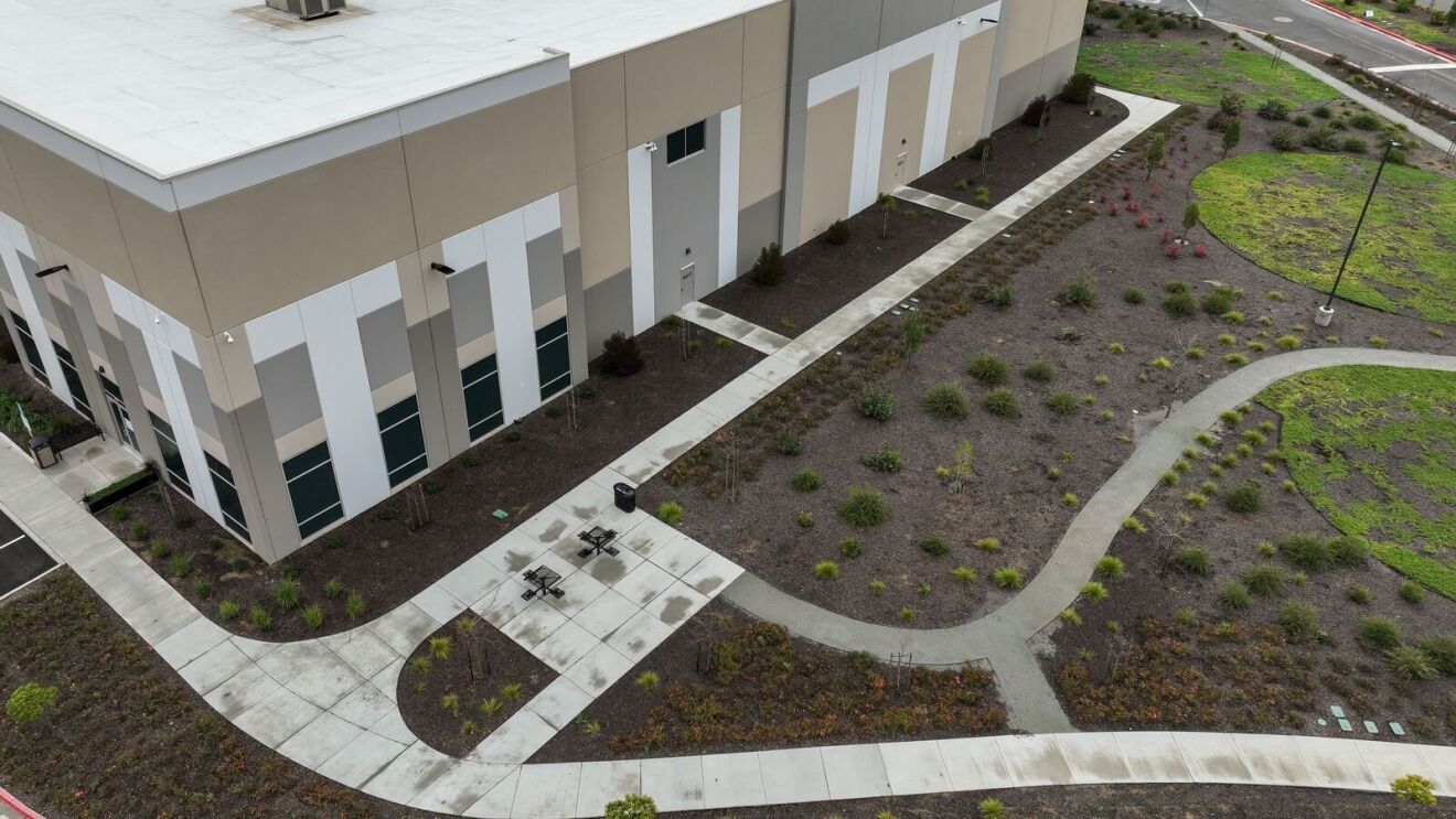 Building exterior with landscaped garden path