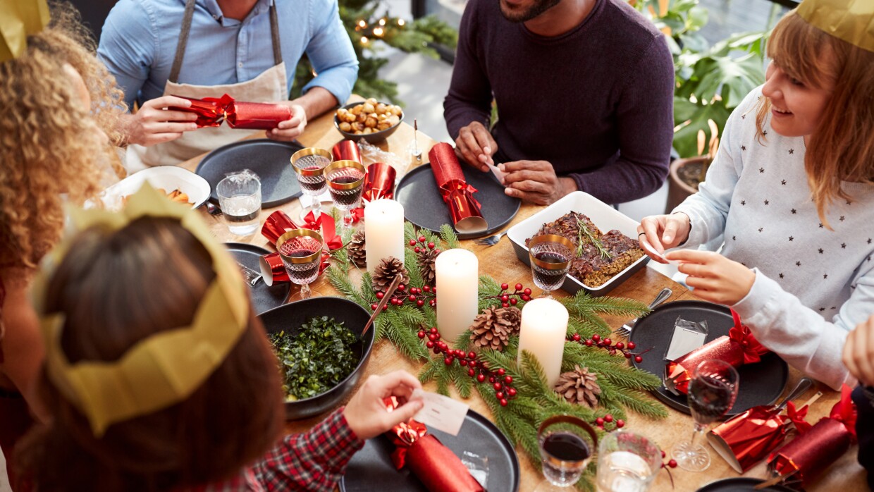 Christmas Lunch with friends reading jokes from crackers