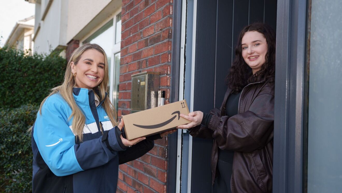 Doorstep delivery scene with Irish model Vogue Williams and grateful recipient exchanging package